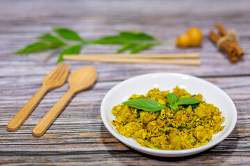 Stir-fried pork with yellow spices from a street food stall