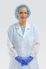 female laboratory scientist in lab coat with goggle