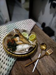 Fried fish and rice on a plate