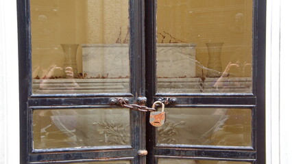 Rusted padlock on the door of a crypt in La Recoleta Cemetery in Buenos Aires, Argentina