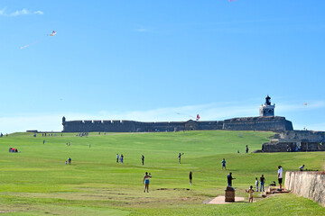 Flying kites aka chiringas on a Sunday at fort El Morro located in Old San Juan city on the island...