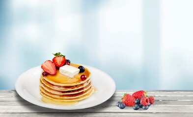 Delicious tasty sweet pancakes with topping.