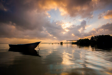 Long Boat near the beach of Tumpat Kelantan, moment during sunrise.