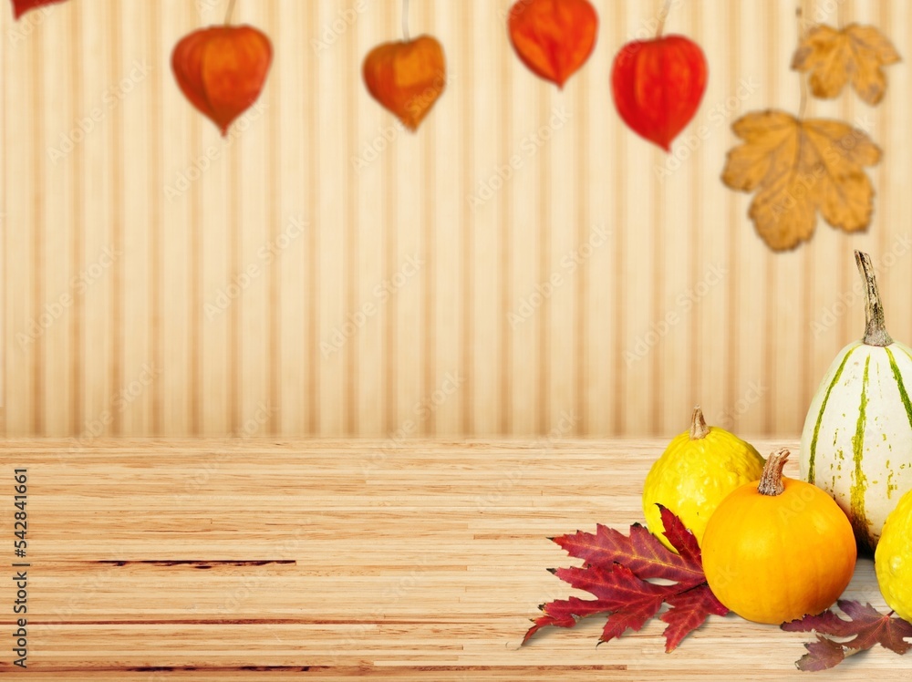 Sticker Fresh ripe pumpkins and fall leaves on the desk