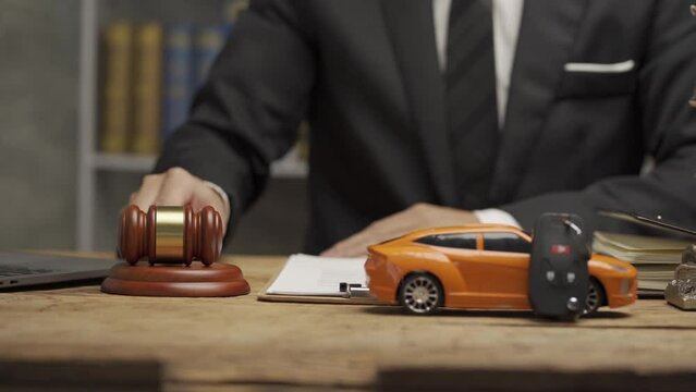 car auction ideas on the table Judge hammer with toy car with close-up document, 4k movie