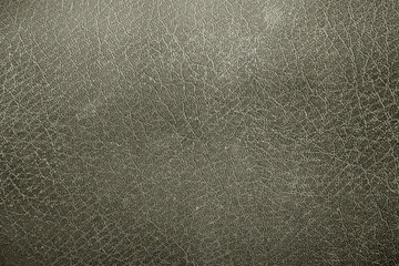 Fototapeta premium Close-up of luxurious leather texture. Detailed close-up of premium leather fabric. Soft leather texture for design purposes. Textured leather surface with subtle detailing
