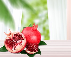 Fresh ripe tasty pomegranates fruits on the desk