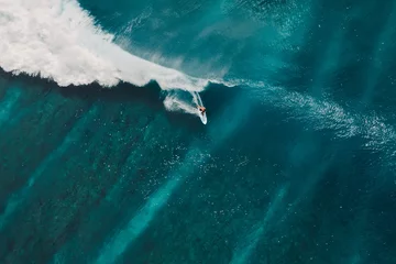 Fototapeten Aerial view with surfing on wave. Perfect waves with surfers in ocean © artifirsov
