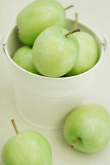 green apples in a bucket