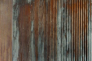 Artistic of old and rusty zinc sheet wall. Vintage style metal sheet roof texture. Pattern of old metal sheet. Rusting metal or siding. Corrosion of galvanized. Background and texture in retro concept