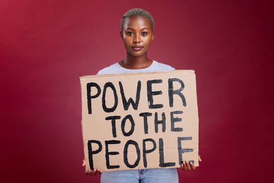 Poster, woman and studio banner power to the people sign by black woman vote, change and empowerment on red background. Portrait, girl and voter message with equality, transformation and human rights