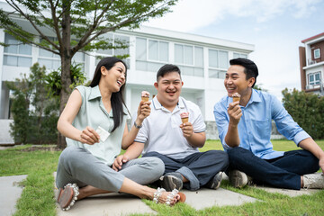 Asian young parents and young son with down syndrome playing in garden