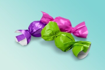 Wrapped tasty sweet Candy on a desk