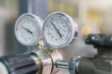 Pressure Gauge, pressure gauge on a gas regulator in a laboratory analytical equipment.