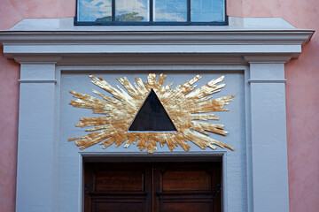 freemason symbol above door on a side street by the castle in Stockholm