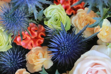 Arrangement of eryngium, cockscomb, rose and carnation