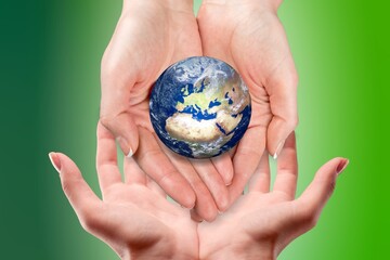 World map globe in human hands