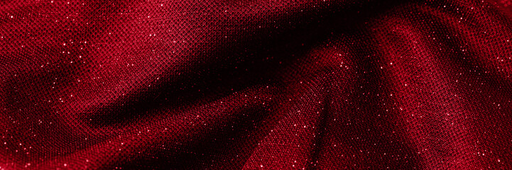 Abstract red fabric with shiny particules background for banner.
