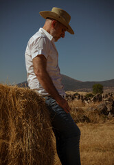 Naklejka na ściany i meble Adult man in cowboy hat in fields. Castilla y Leon, Spain