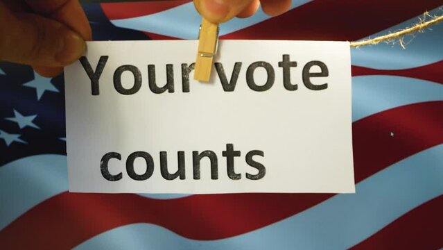 Your vote counts plaque on the background of the American flag. Midterm elections to the US Senate in November 2022, Republicans and Democrats. Turnout, invitation to come to the polling station