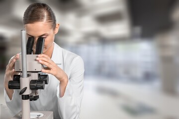 Fototapeta na wymiar Scientist person works on microscope in modern laboratory