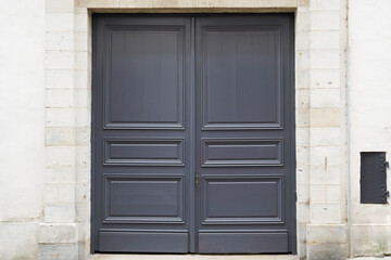Fototapeta na wymiar grey wooden front door of street restored house entrance wood classic gate
