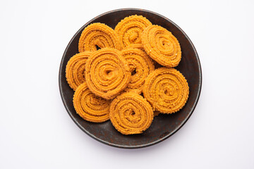 Chakli is a savoury snack from India. It is a spiral shaped snack with a spiked surface