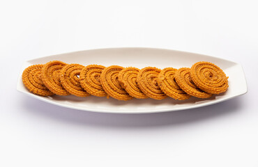 Chakli is a savoury snack from India. It is a spiral shaped snack with a spiked surface