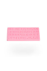 Close-up shot of a pink silicone letter mold for cake decorating in the shape of the Russian alphabet. Alphabet silicone mold for cake decoration is isolated on a white background. Front view.