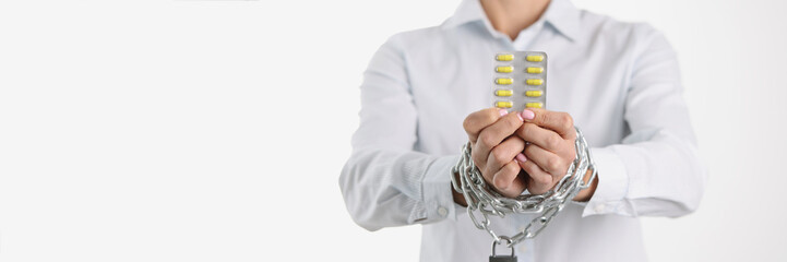Addictive woman taking too many drugs with chain