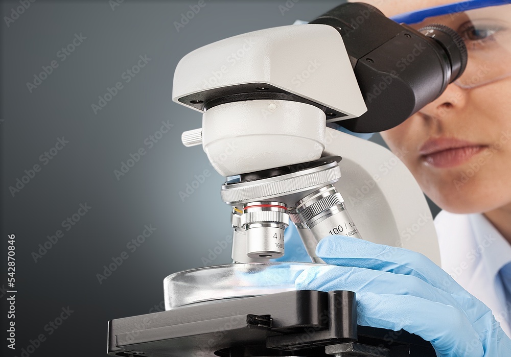 Poster scientist person working with microscope in laboratory.