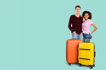 Happy young friends traveler posing with suitcase