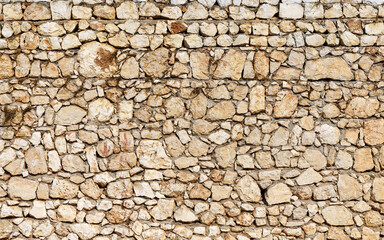 Ancient stone wall background. Old texture stonework material of ancient building house. History, ruins concept