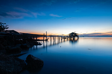 Fototapeta na wymiar Beautiful sunrise view at fisherman jetty in Jelutong, Penang Malaysia. 