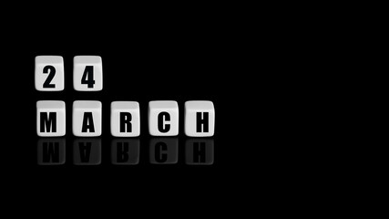 March 24th. Day 24 of month, Calendar date. White cubes with text on black background with reflection.Spring month, day of year concept