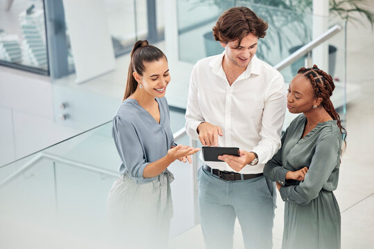 Marketing collaboration, tablet teamwork and office employees look at idea for digital advertising campaign presentation. Group feedback, workers consult mentor and talk together on workplace stairs