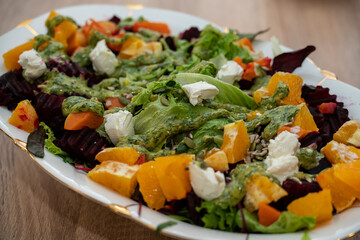 Ready-made grilled beetroot, pumpkin, orange, cream cheese salad.