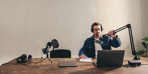 Young radio dj preparing to go live on air