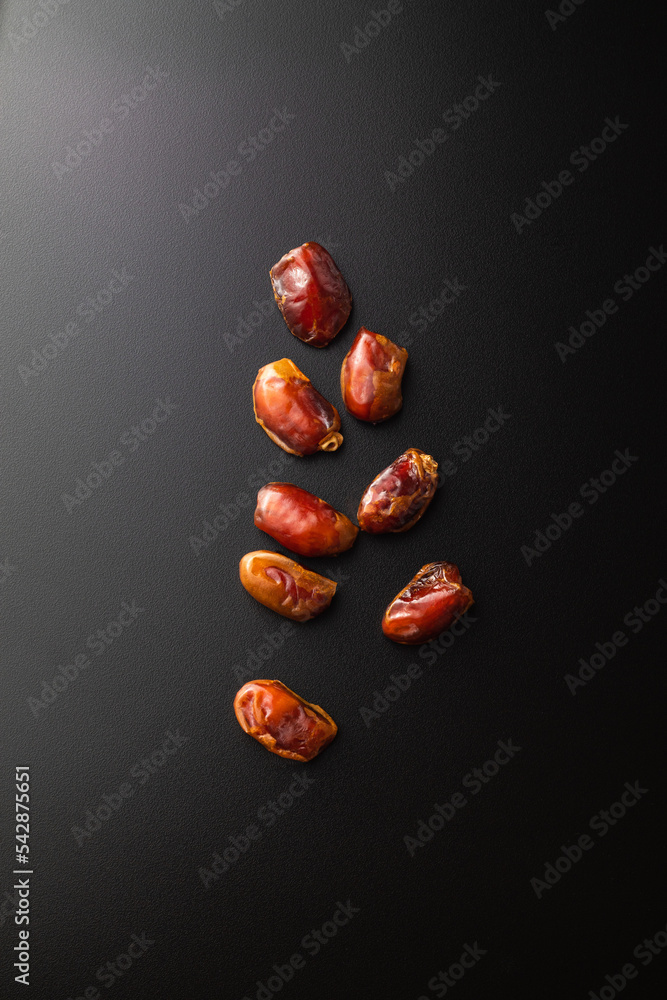 Wall mural dates fruit on dark background with copy spaces. arabian fruit