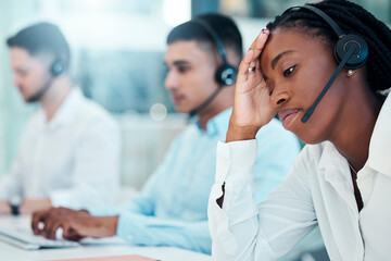 Headache, call center and burnout with a black woman in telemarketing looking tired or exhausted....