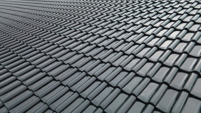 Close up of black, burnt roofing on the roof, construction and building concept