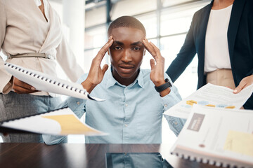 Headache, overwhelmed businessman and work report stress in office with team. Black man, stressed business management leader and corporate mental health burnout or frustrated employee depression