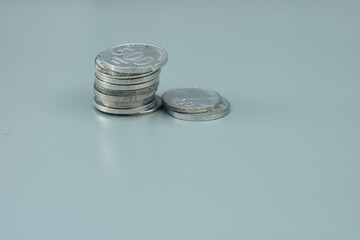 collection of Indonesian state coins, with gray copy space or negative space, Indonesian rupiah