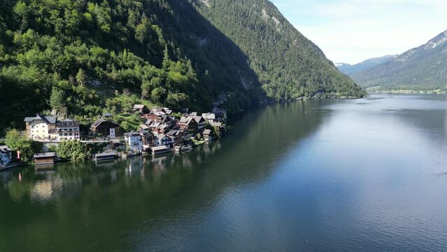 Hallstatt Austria beautiful lakeside village pull back drone aerial view 4K