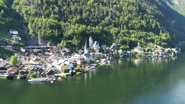 Hallstatt Austria beautiful lakeside village pull back reveal drone aerial view