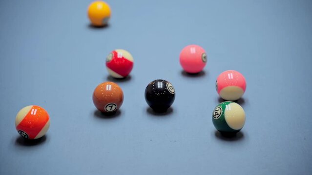 Billiard opening break shot. In a billiard club or a night club billiard balls are on a pool table, game is going to begin. First break shot, slow motion