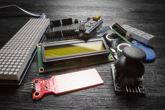 Microprocessor programming parts on the black table concept background.