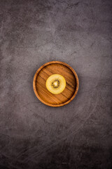 golden kiwi on dark background