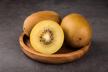golden kiwi on dark background