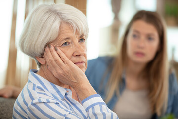 strong quarrel between elderly mother and her adult daughter - obrazy, fototapety, plakaty